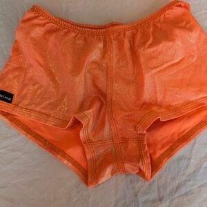 Skin Shimmering Orange Athletic Shorts